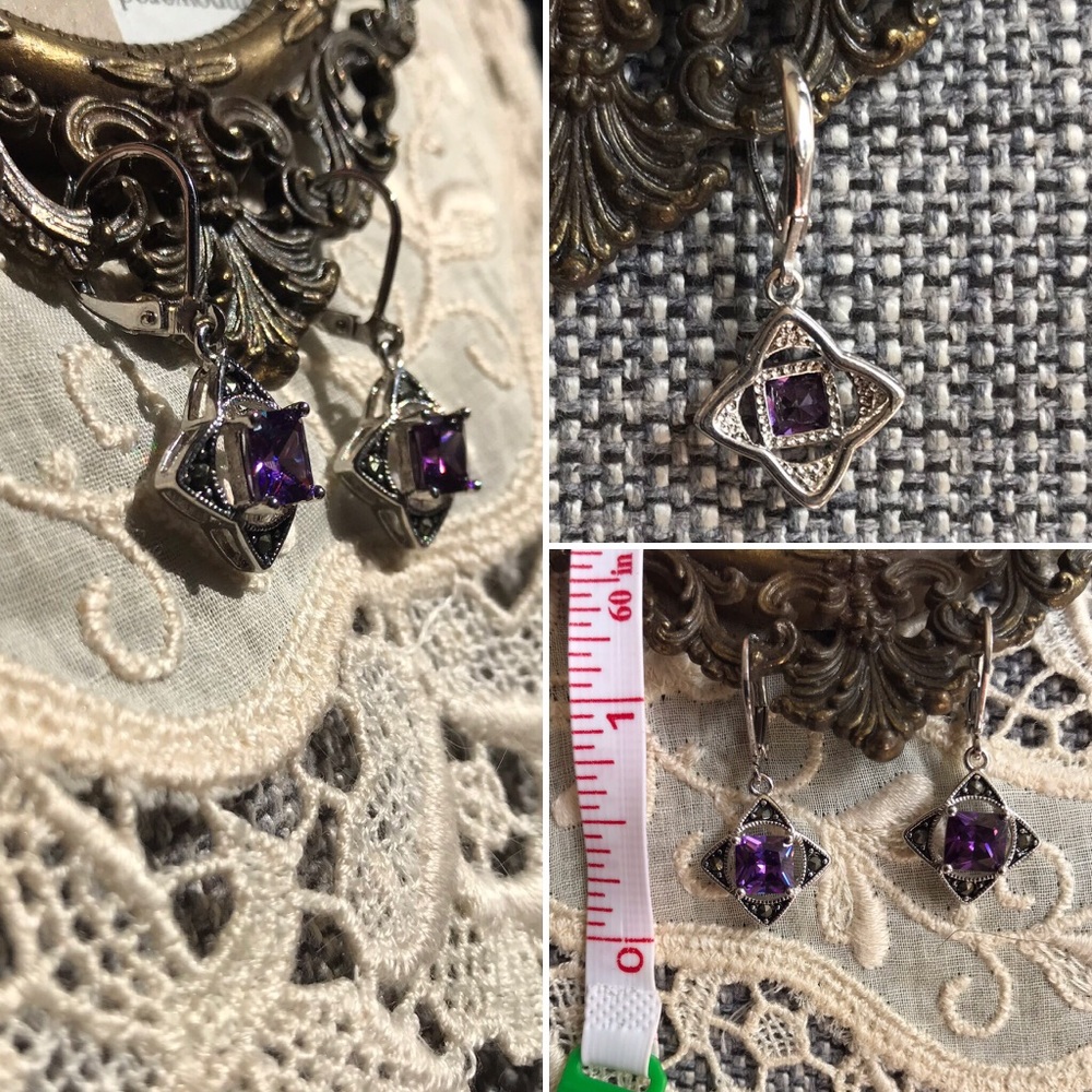 Silver dangle earrings with purple gemstone.